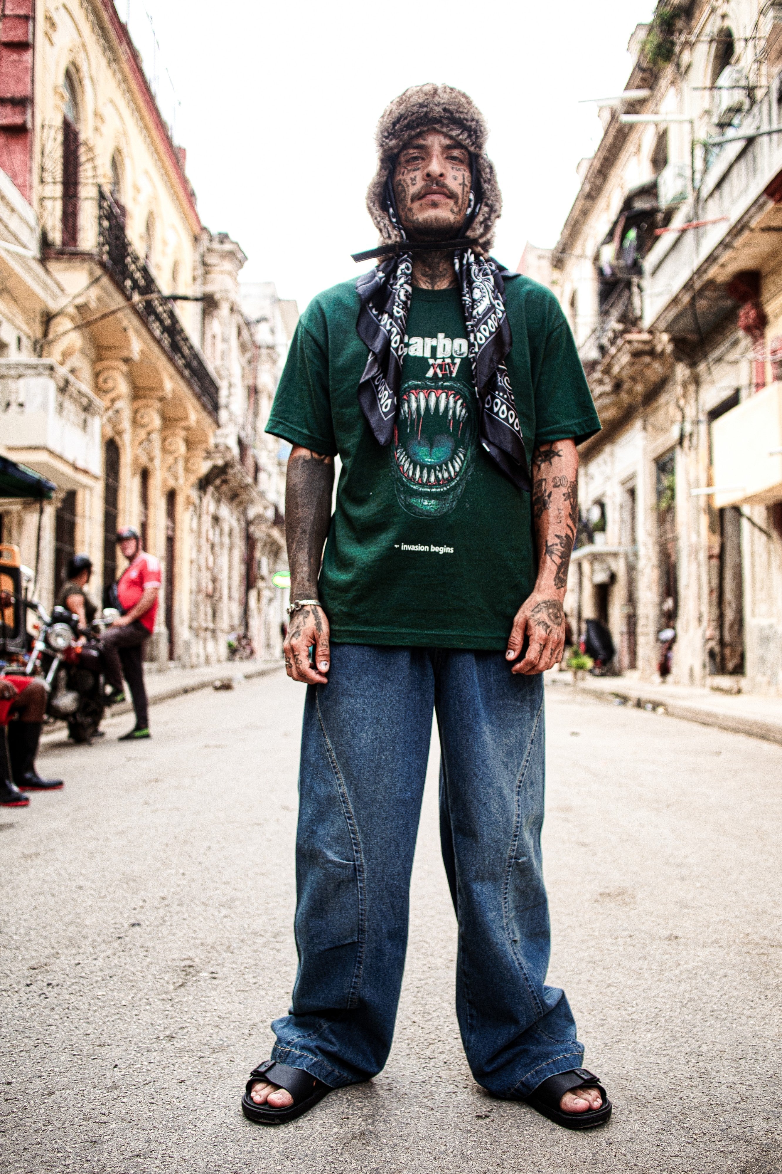 A model is wearing Carbon XV T-Shirt – Embrace the Invasion | Carbon XIV